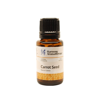 Carrot Seed essential oil on white background