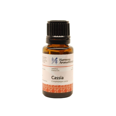 Cassia essential oil on white background