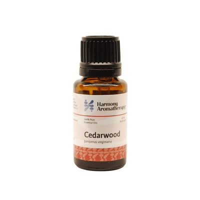 Cedarwood essential oil on white background