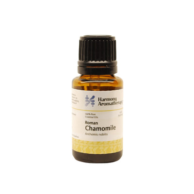 Roman Chamomile essential oil on white background