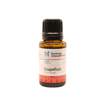 Grapefruit essential oil on white background