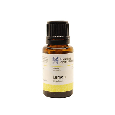 Lemon essential oil on white background
