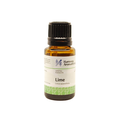 Lime essential oil on white background