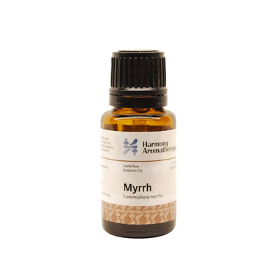 Myrrh essential oil on white background