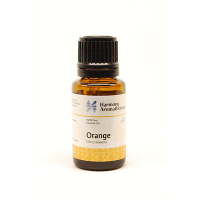 Orange essential oil on white background