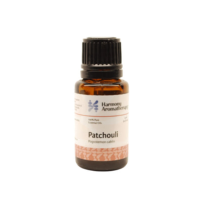 Patchouli essential oil on white background