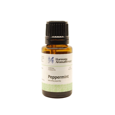 Peppermint essential oil on white background