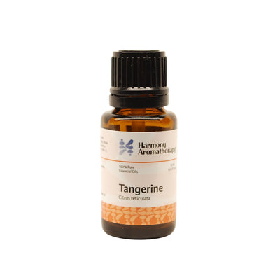 Tangerine essential oil on white background