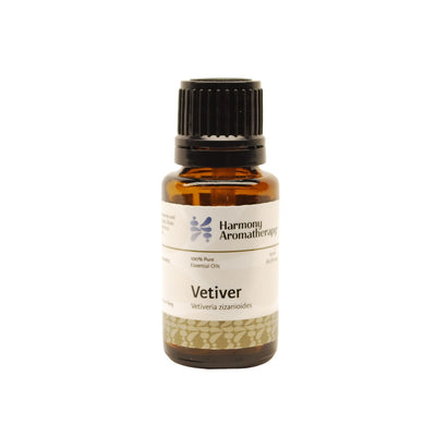 Vetiver essential oil on white background