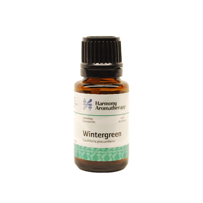 Wintergreen essential oil on white background